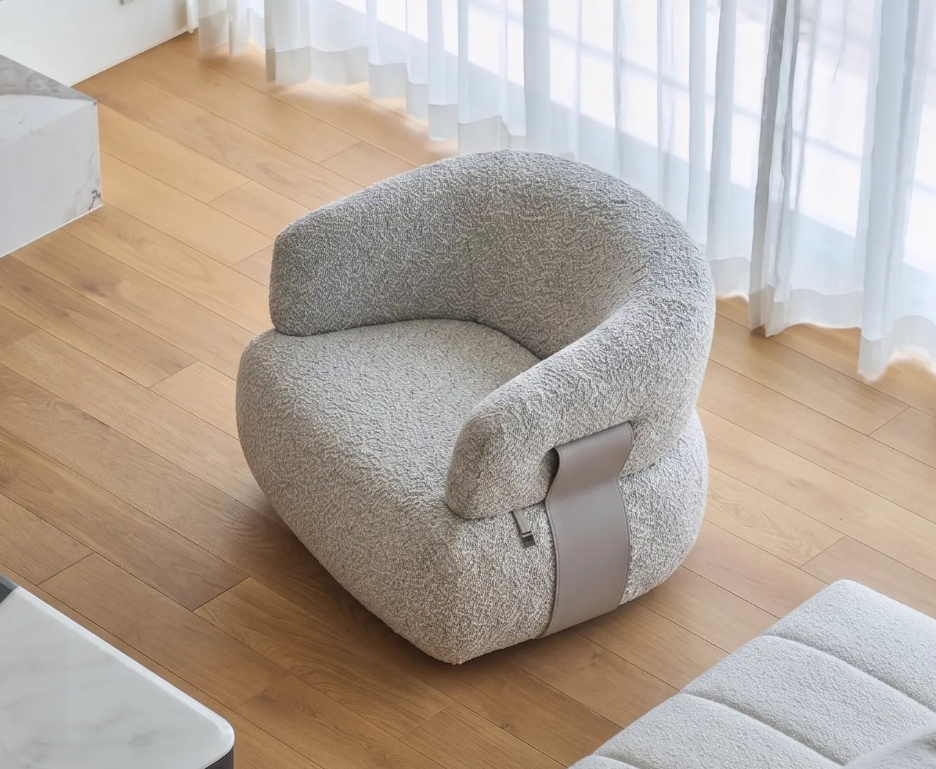 Teddy Lounge Chair in softly textured grey upholstery